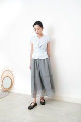 Baby blue vest in overlaping waist details