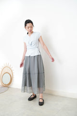 Baby blue vest in overlaping waist details