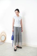 Baby blue vest in overlaping waist details