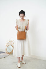 Beige double layers vest in ruffle shoulders