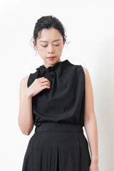 Black vest w/ gather collar strings