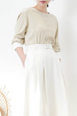 Beige top w/ white cuffs