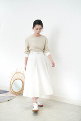 Beige top w/ white cuffs