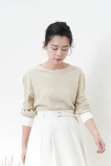 Beige top w/ white cuffs