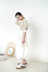Beige top w/ white cuffs