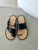 Black asymmetrical shape sandals