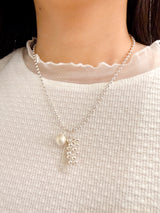 Chain necklace w/ ball and tessal pendant