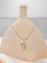 Chain necklace w/ ball and tessal pendant