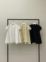 Yellow blouse in lace round neck