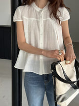 Yellow blouse in lace round neck