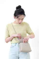 Grey leather cross body bag in thin strap