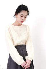 Ivory blouse in fringe trimmed details