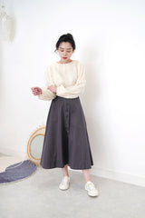 Ivory blouse in fringe trimmed details