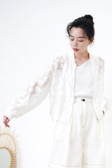 White bomber jacket in sheer floral pattern