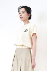 Cream embroidery top in elastic hem