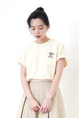 Cream embroidery top in elastic hem