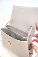Grey leather cross body bag in thin strap