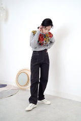 Grey knit sweater in floral cross stitch