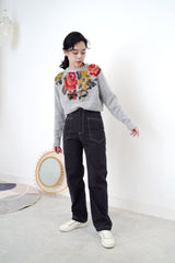Grey knit sweater in floral cross stitch