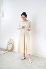 Cream pleats skirt w/ buttons