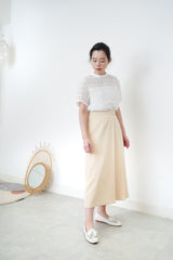 Cream pleats skirt w/ buttons
