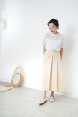 Cream pleats skirt w/ buttons