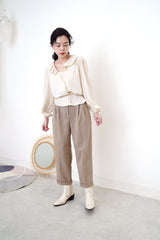 Ivory satin blouse in elastic peplum hem