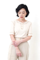 Nude outlined details button top