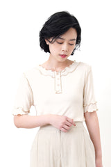 Nude outlined details button top