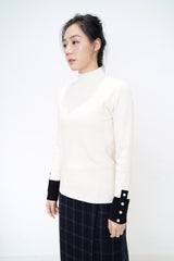 Ivory knit top w/ contrast buttons cuff