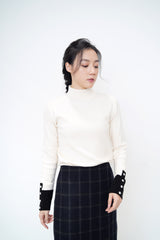 Ivory knit top w/ contrast buttons cuff