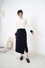 Black checked wool skirt in asy. hem