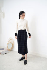 Black checked wool skirt in asy. hem