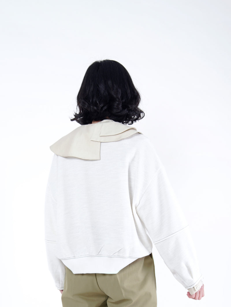 White pullover in contrast stitching