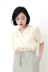 Light yellow v neck smooth shirt