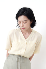 Light yellow v neck smooth shirt