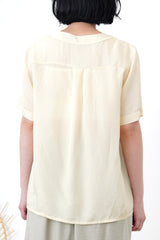 Light yellow v neck smooth shirt