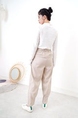 Nude pencil cut trousers in pleats hem