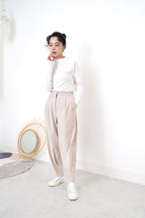 Nude pencil cut trousers in pleats hem