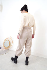 Nude pencil cut trousers in pleats hem