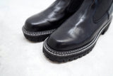Black outlined chunky chelsea boots