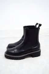 Black outlined chunky chelsea boots