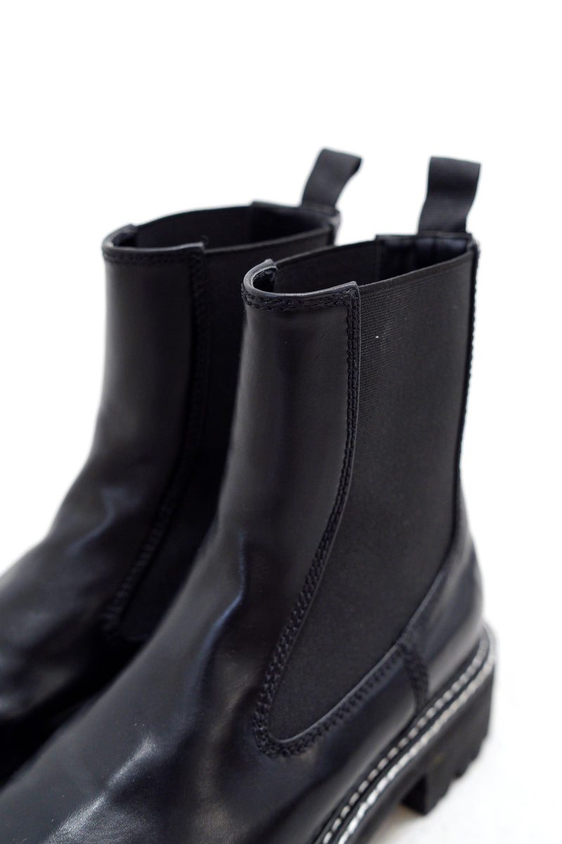 Black outlined chunky chelsea boots