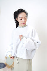 light grey pullover w/ elastic string hem