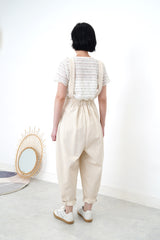 Ivory pleats trousers w/ straps