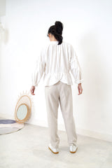 White linen blouse in peplum hem