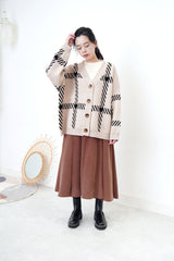 Beige loose cut cardigan in check pattern