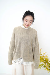 Beige smooth sweater in cut out hem