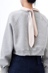 Grey crop cut pullover in stepped hem