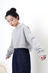 Grey crop cut pullover in stepped hem